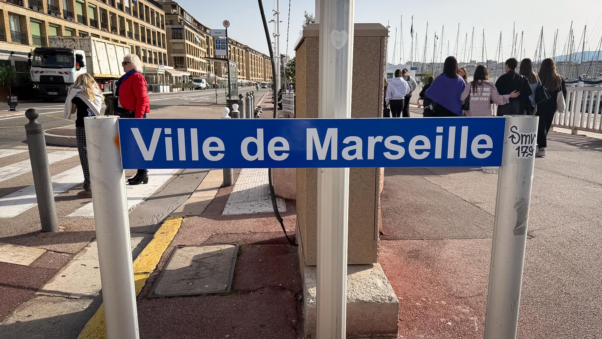 A city sign with the inscription "City of Marseille"